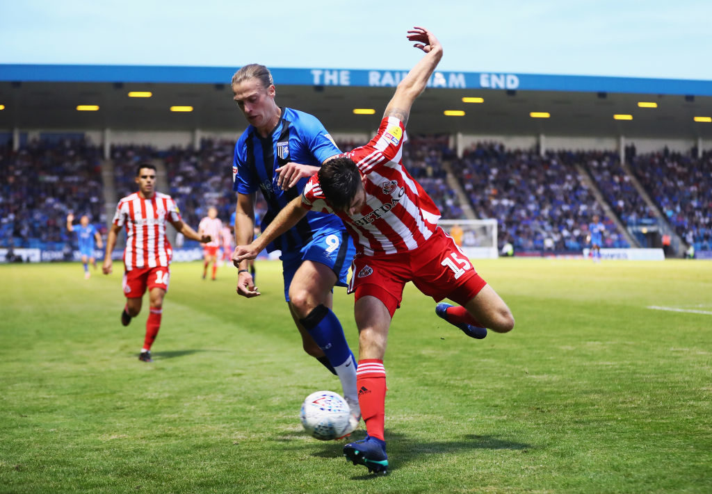GILLINGHAM, UNITED KINGDOM - AUGUST 22:  Tom Eaves of Gillingham battles for posession with Jack Baldwin of Sunderland during the Sky Bet League One match between Gillingham and Sunderland at Priestfield Stadium on August 22, 2018 in Gillingham, United Kingdom.  (Photo by Naomi Baker/Getty Images)