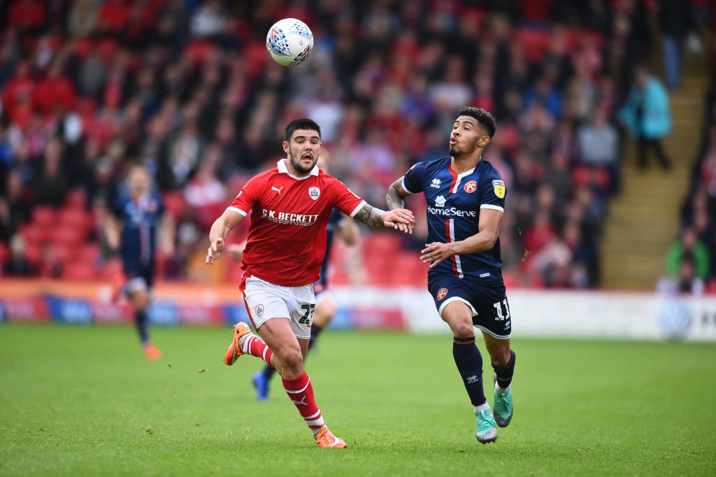 BARNSLEY, ENGLAND - SEPTEMBER 08: Daniel Pinillos of Barnsley and Josh Ginnelly of Walsall in action during the Sky Bet League One match between Barnsley and Walsall at Oakwell Stadium on September 8, 2018 in Barnsley, United Kingdom. (Photo by Nathan Stirk/Getty Images)
