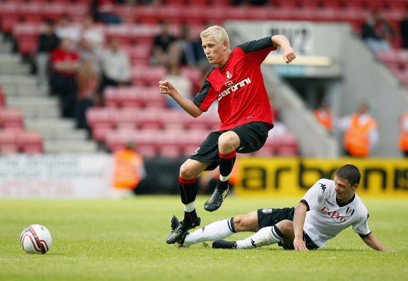 BOURNEMOUTH, ENGLAND - JULY 17: Chris Baird (R) of Fulham and Jayden Stockley of Bournemouth battle for the ball during the pre season friendly match between AFC Bournemouth and Fulham at the Fitness First Stadium on July 17, 2010 in Bournemouth, England. (Photo by Tom Dulat/Getty Images)