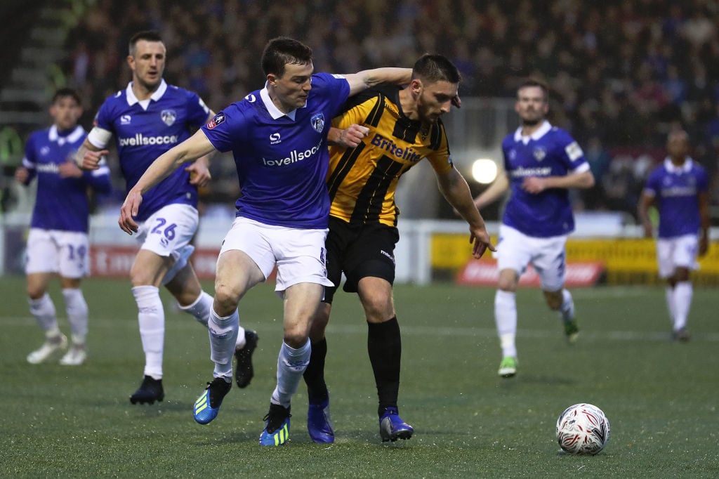 MAIDSTONE, ENGLAND - DECEMBER 01: Jake Cassidy of Maidstone United is tackled by Samuel Edmundson of Oldham Athletic during the FA Cup Second Round match between Maidstone United and Oldham Athletic at Gallagher Stadium on December 01, 2018 in Maidstone, England. (Photo by Bryn Lennon/Getty Images)