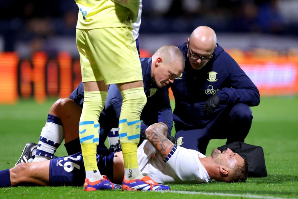 Patrick Bauer of Preston North End receives medical treatment during the Carabao Cup Third Round match between Preston North End and Fulham at Deep...